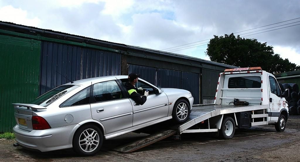 Towing a silver car
